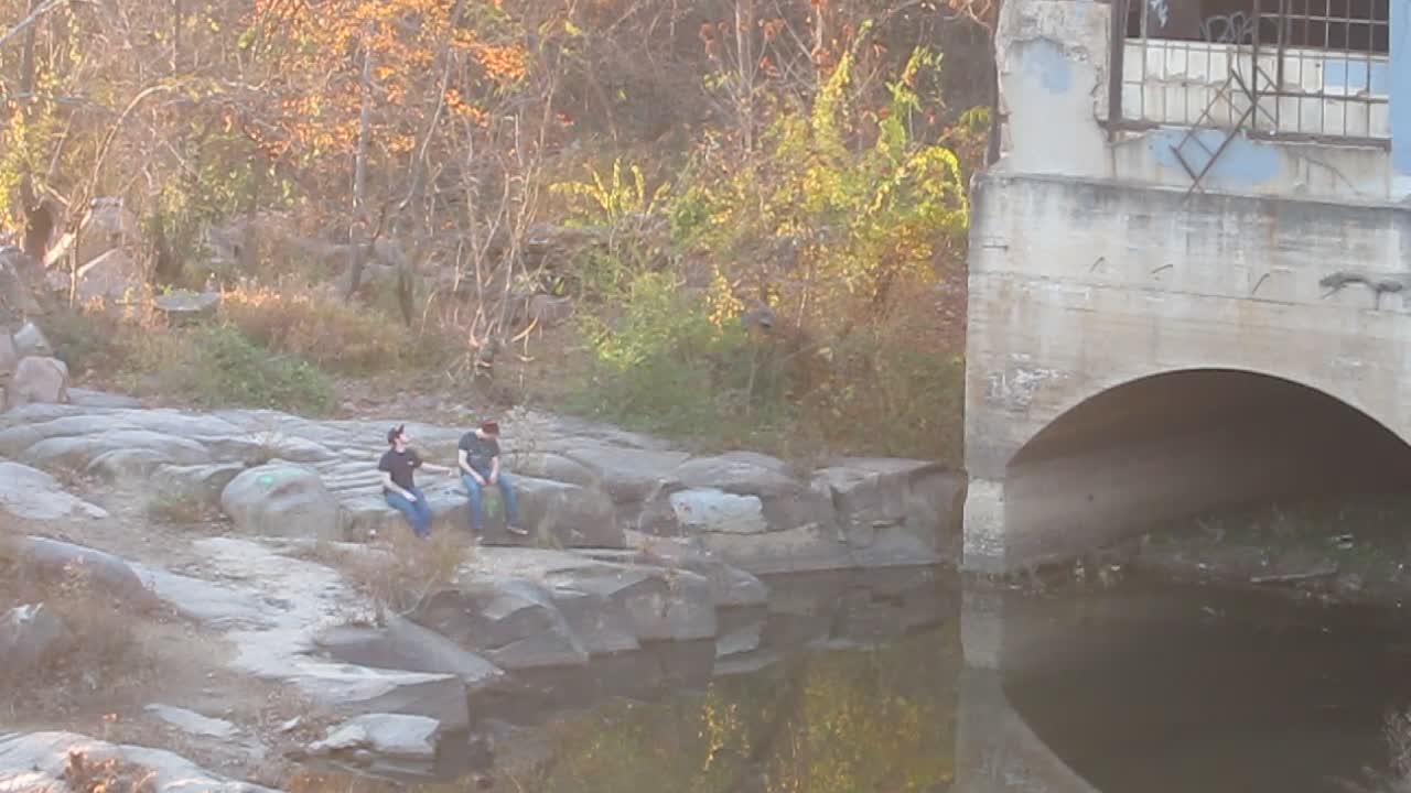 Guys just hanging out on rocks near old hydroelectric plant (Belle Isle)